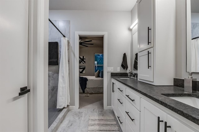 bathroom with a shower with curtain and vanity