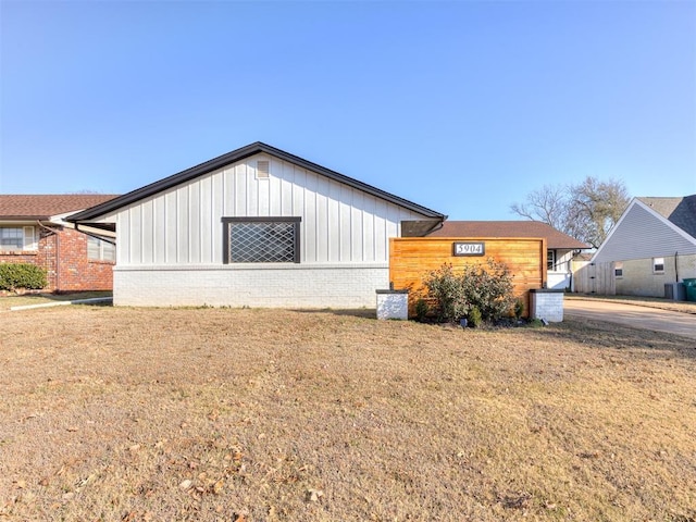 view of property exterior with a lawn