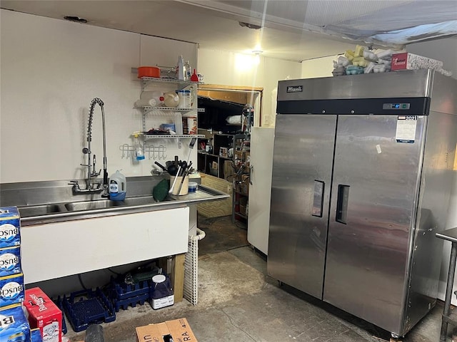 kitchen featuring stainless steel counters and stainless steel refrigerator