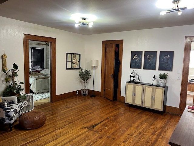 interior space featuring dark hardwood / wood-style floors and an inviting chandelier