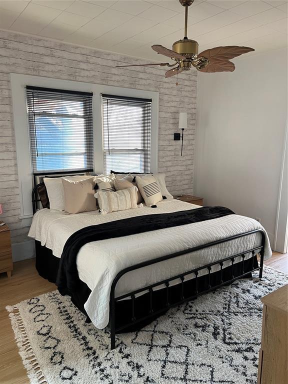 bedroom featuring ceiling fan and light hardwood / wood-style floors