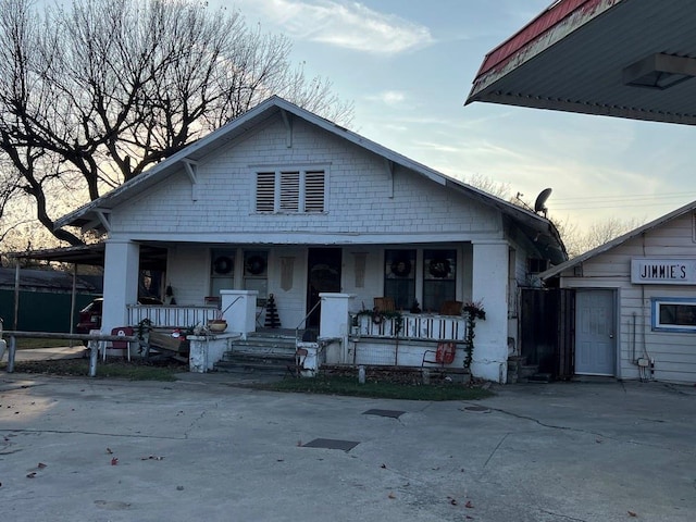 bungalow-style home with covered porch