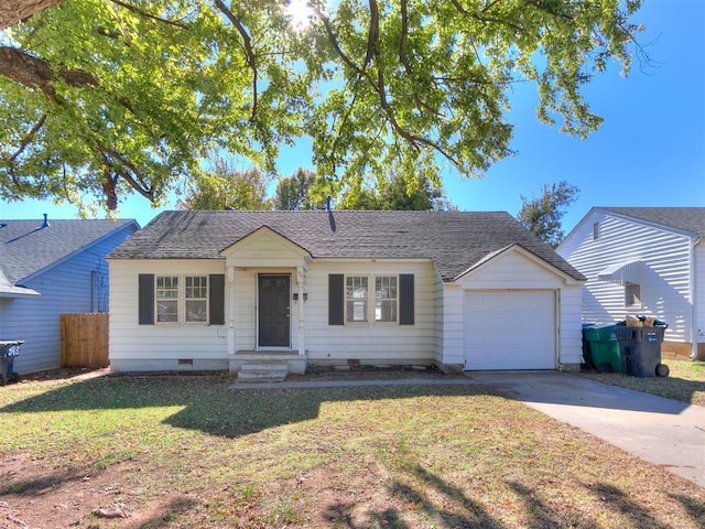 ranch-style home with a garage and a front yard