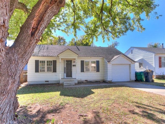 ranch-style house with a garage and a front lawn