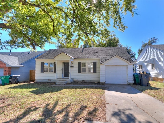 single story home featuring a garage and a front lawn