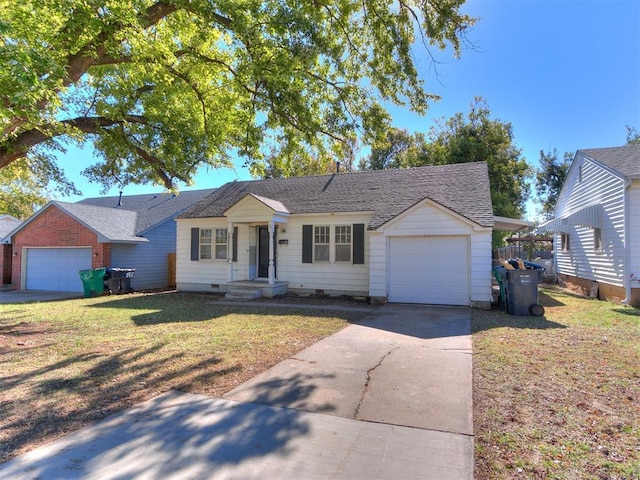 ranch-style home with a front yard and a garage