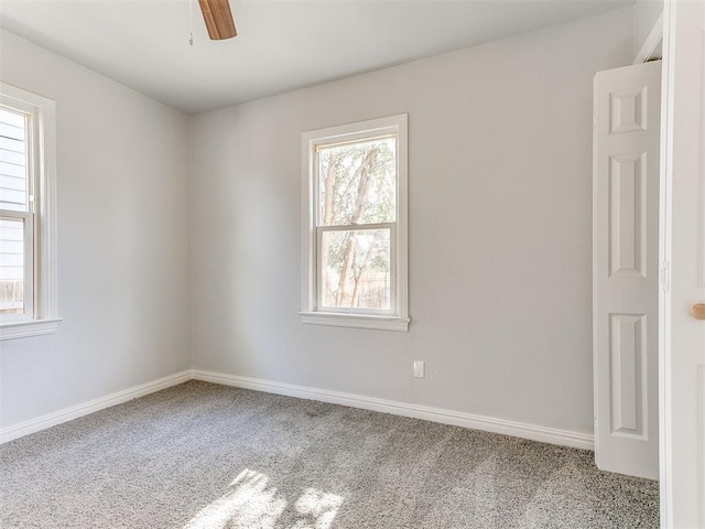 carpeted empty room with ceiling fan