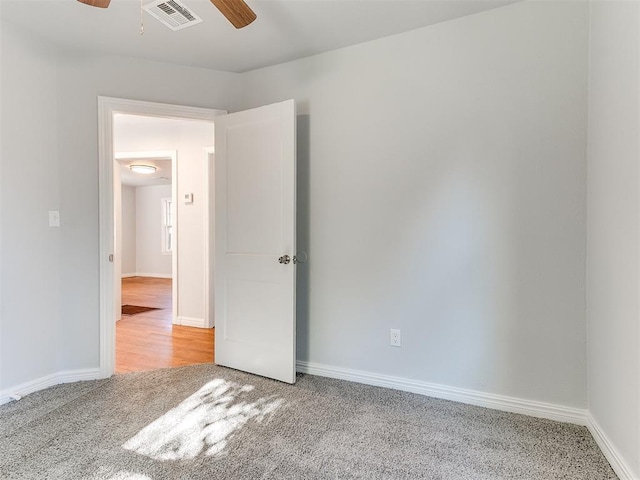 carpeted empty room with ceiling fan