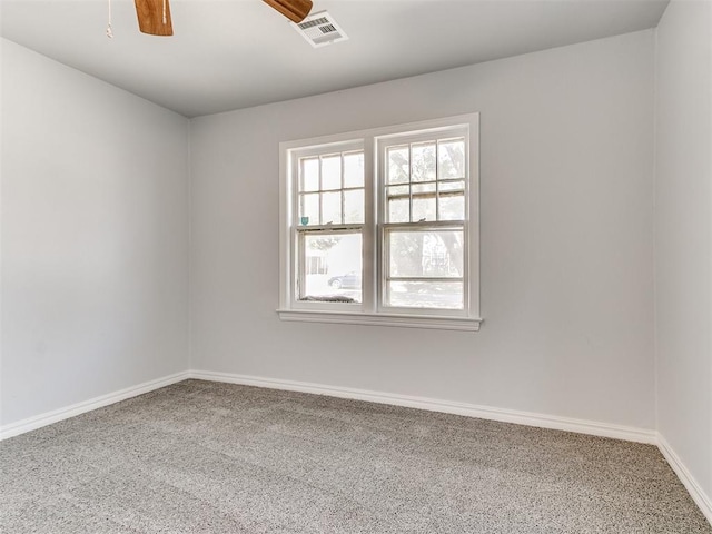 carpeted empty room with ceiling fan