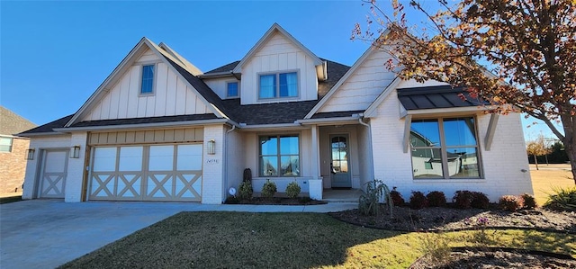 view of front of property featuring a garage and a front lawn