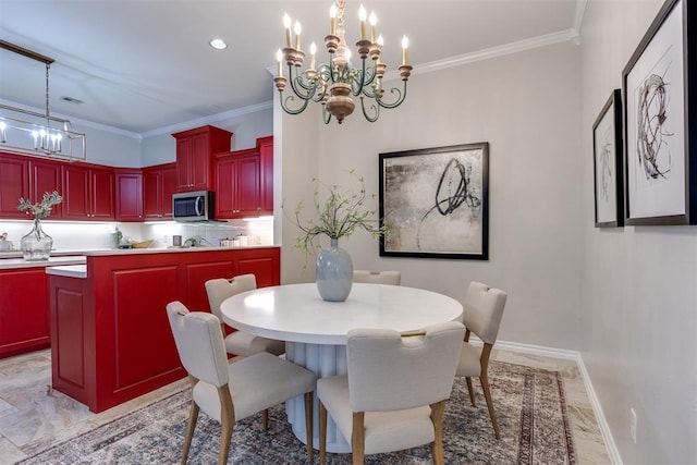 dining area with crown molding and a notable chandelier