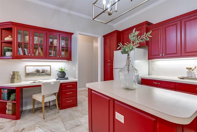 kitchen featuring white refrigerator, ornamental molding, and backsplash