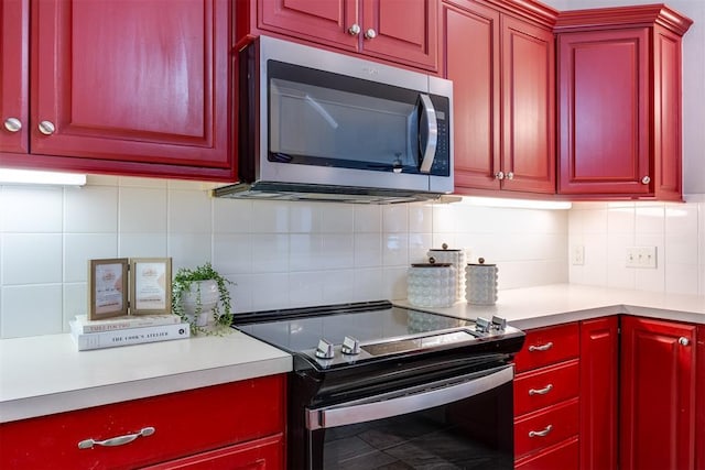 kitchen featuring appliances with stainless steel finishes and decorative backsplash