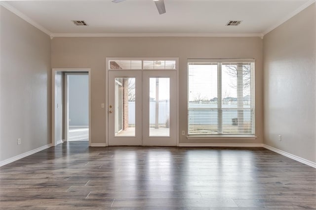 doorway with ornamental molding, dark wood-type flooring, and ceiling fan