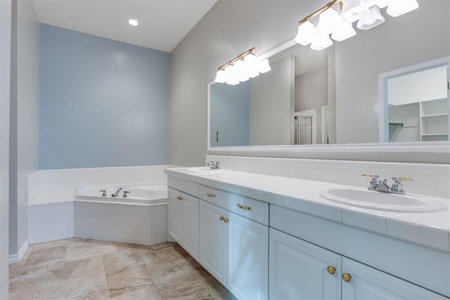 bathroom featuring independent shower and bath and vanity