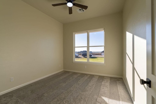 carpeted empty room featuring ceiling fan