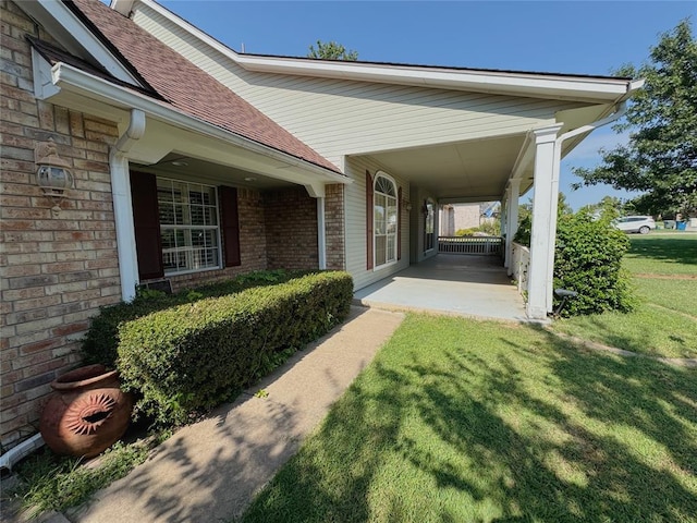 exterior space with a lawn and a porch