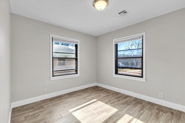 unfurnished room featuring light wood-type flooring