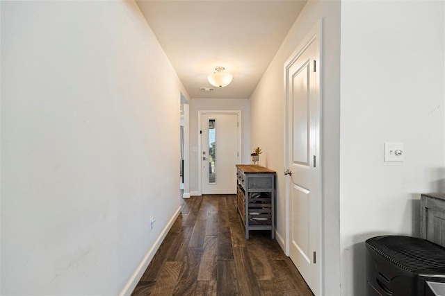 hall with dark wood-type flooring