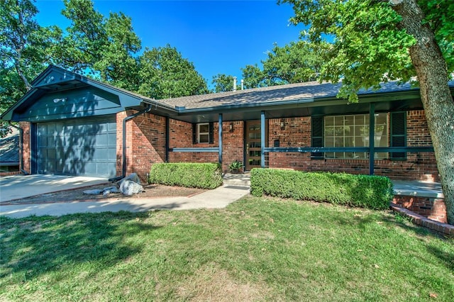 single story home featuring brick siding, covered porch, concrete driveway, a front yard, and a garage