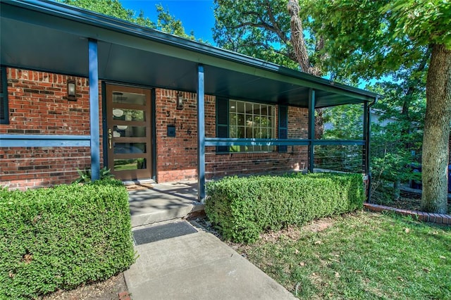 doorway to property with a porch