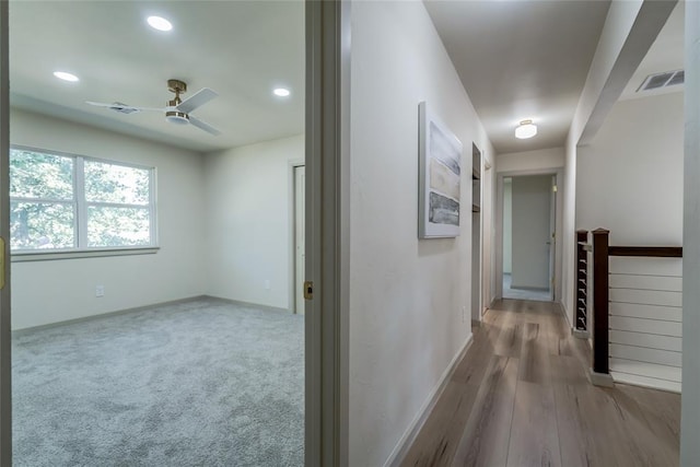 hall with light hardwood / wood-style floors