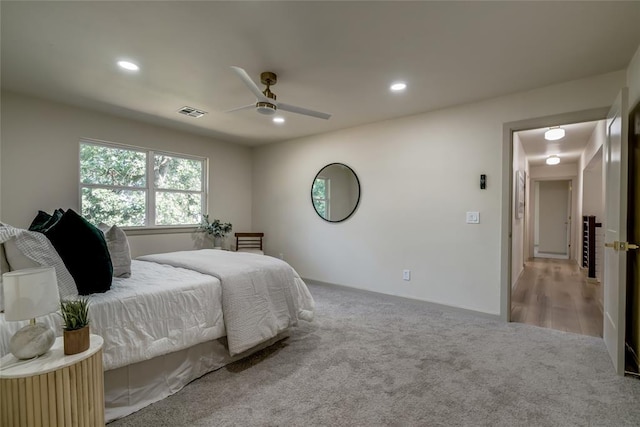 carpeted bedroom with ceiling fan