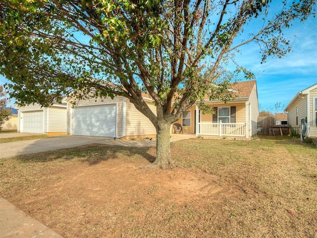 single story home with a porch, a garage, and a front lawn