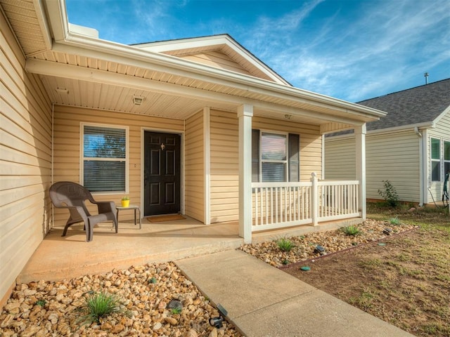 doorway to property featuring covered porch