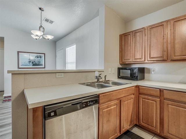 kitchen featuring sink, stainless steel dishwasher, pendant lighting, a chandelier, and light hardwood / wood-style floors