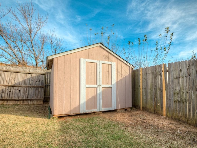 view of outbuilding with a yard