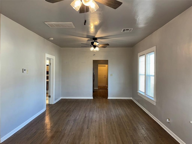 empty room with ceiling fan and dark wood-type flooring