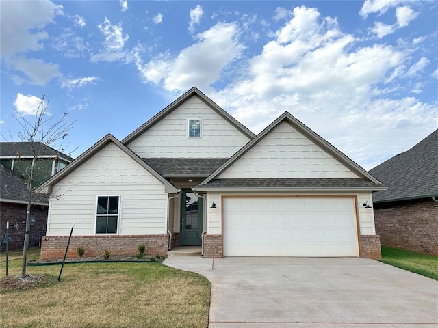 craftsman-style home featuring a garage and a front lawn