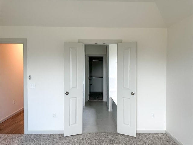 unfurnished bedroom with carpet flooring