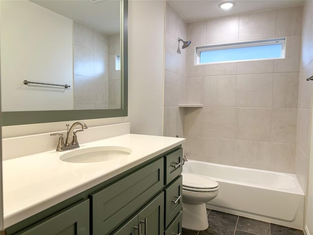 full bathroom with vanity, toilet, and tiled shower / bath combo