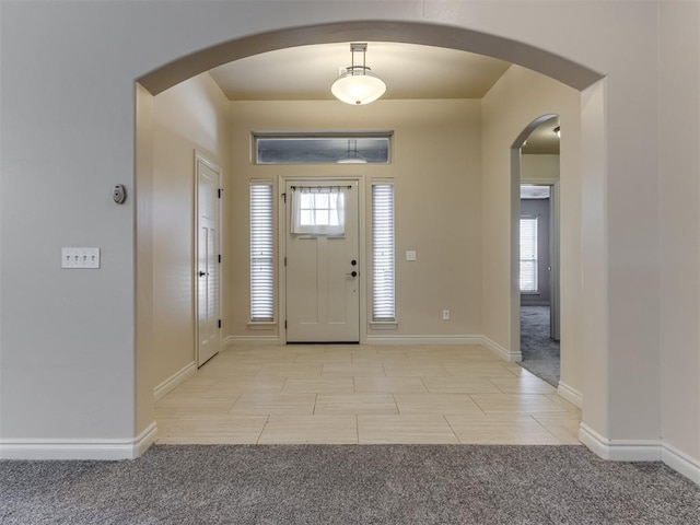 view of carpeted entrance foyer