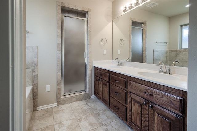 bathroom featuring tile patterned flooring, vanity, and a bathing tub