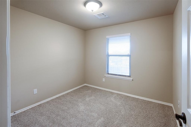 spare room with carpet floors