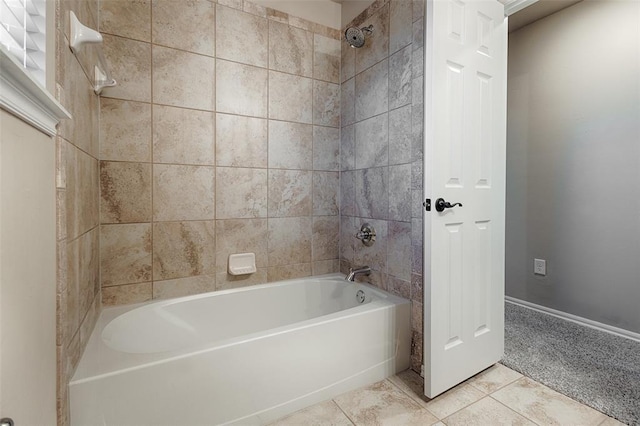 bathroom featuring tile patterned flooring and tiled shower / bath combo