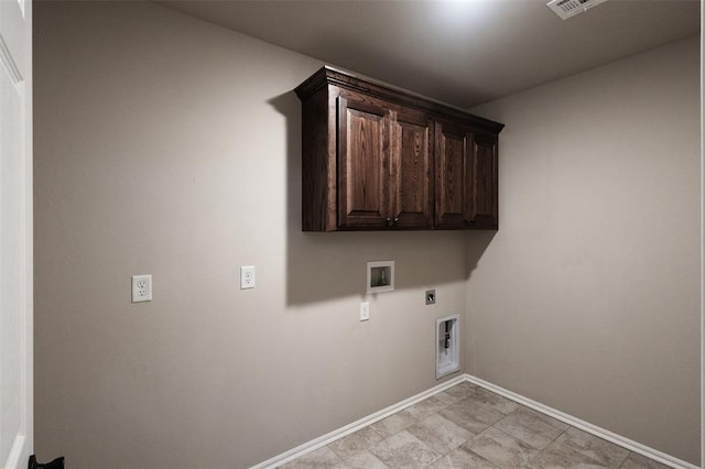 laundry room with cabinets, hookup for a washing machine, and electric dryer hookup