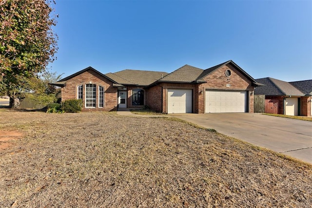 view of front facade with a garage and a front yard