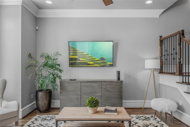 living room with hardwood / wood-style floors and ornamental molding