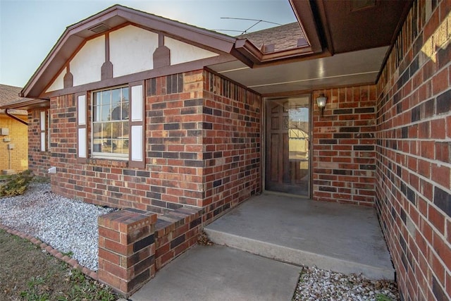 doorway to property with a patio area