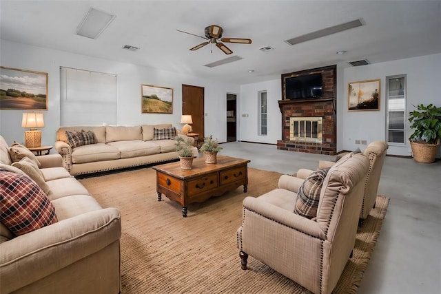 living room featuring a fireplace and ceiling fan