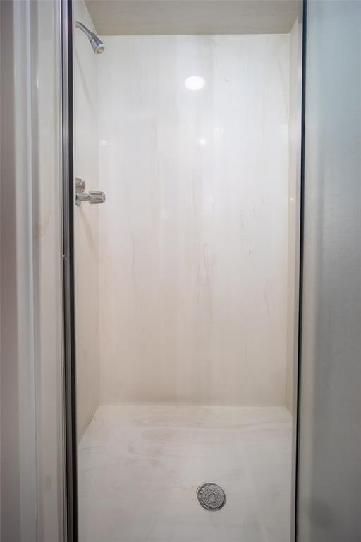 full bathroom with a stall shower