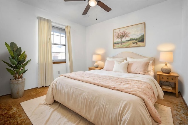 bedroom with ceiling fan and carpet