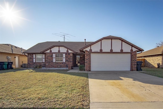 view of front facade with a garage, central AC unit, and a front lawn