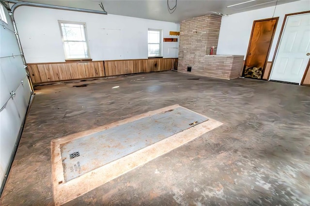 garage featuring wood walls