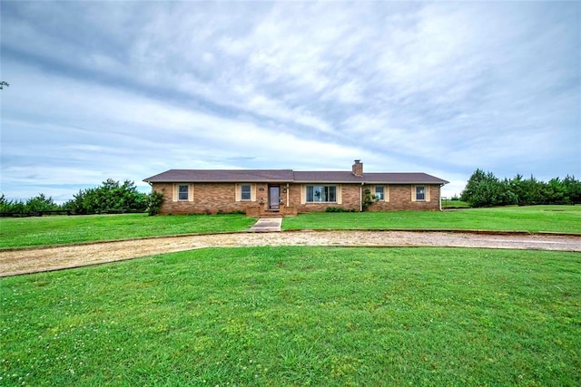 920173 S 3450th Rd, Chandler, OK 74834 - ranch-style house with a front lawn, a chimney, and brick siding
