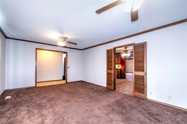 920173 S 3450th Rd, Chandler, OK 74834 - unfurnished bedroom featuring carpet floors, ornamental molding, baseboards, and a ceiling fan